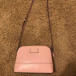 Light pink kate spade side purse.